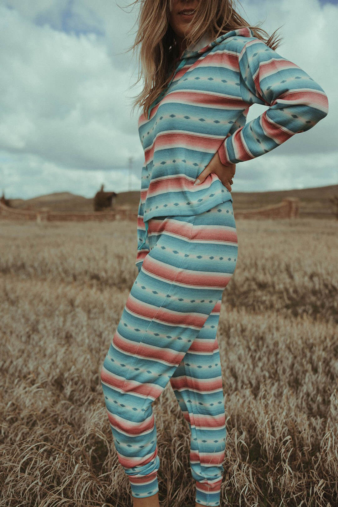 Woman modeling the Turquoise Serape Joggers. 