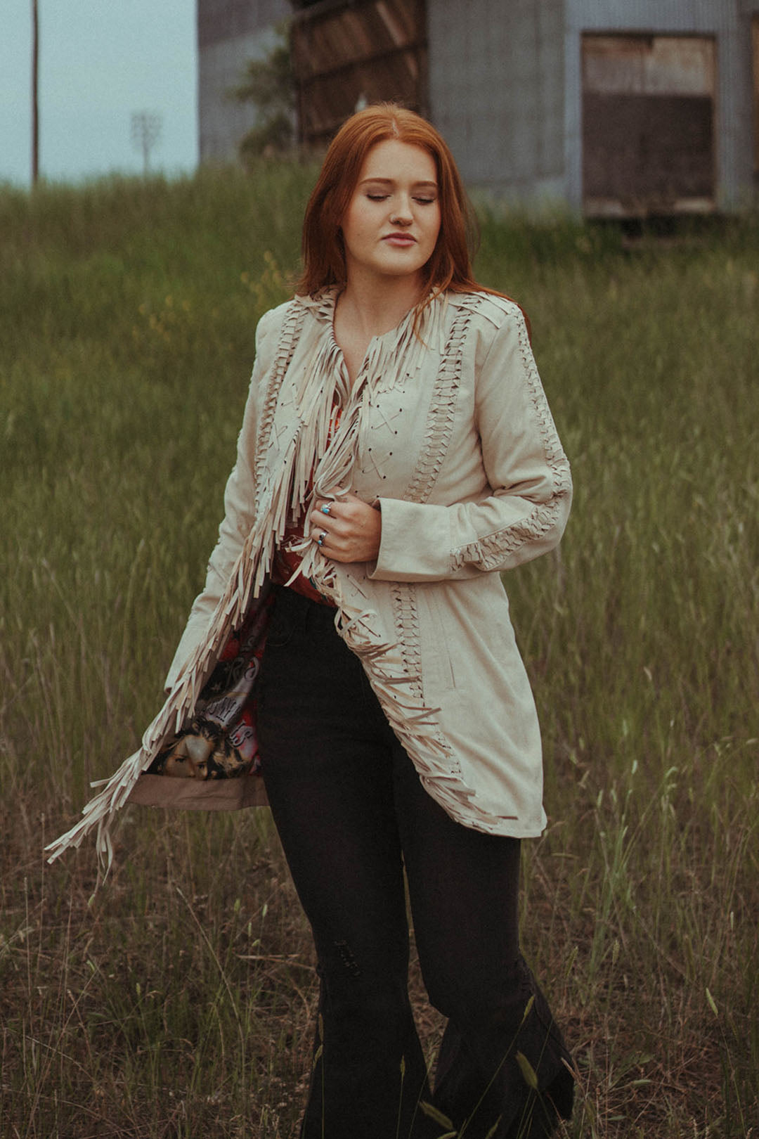 Woman modeling the Old West Suede Jacket.  Tan in color.  