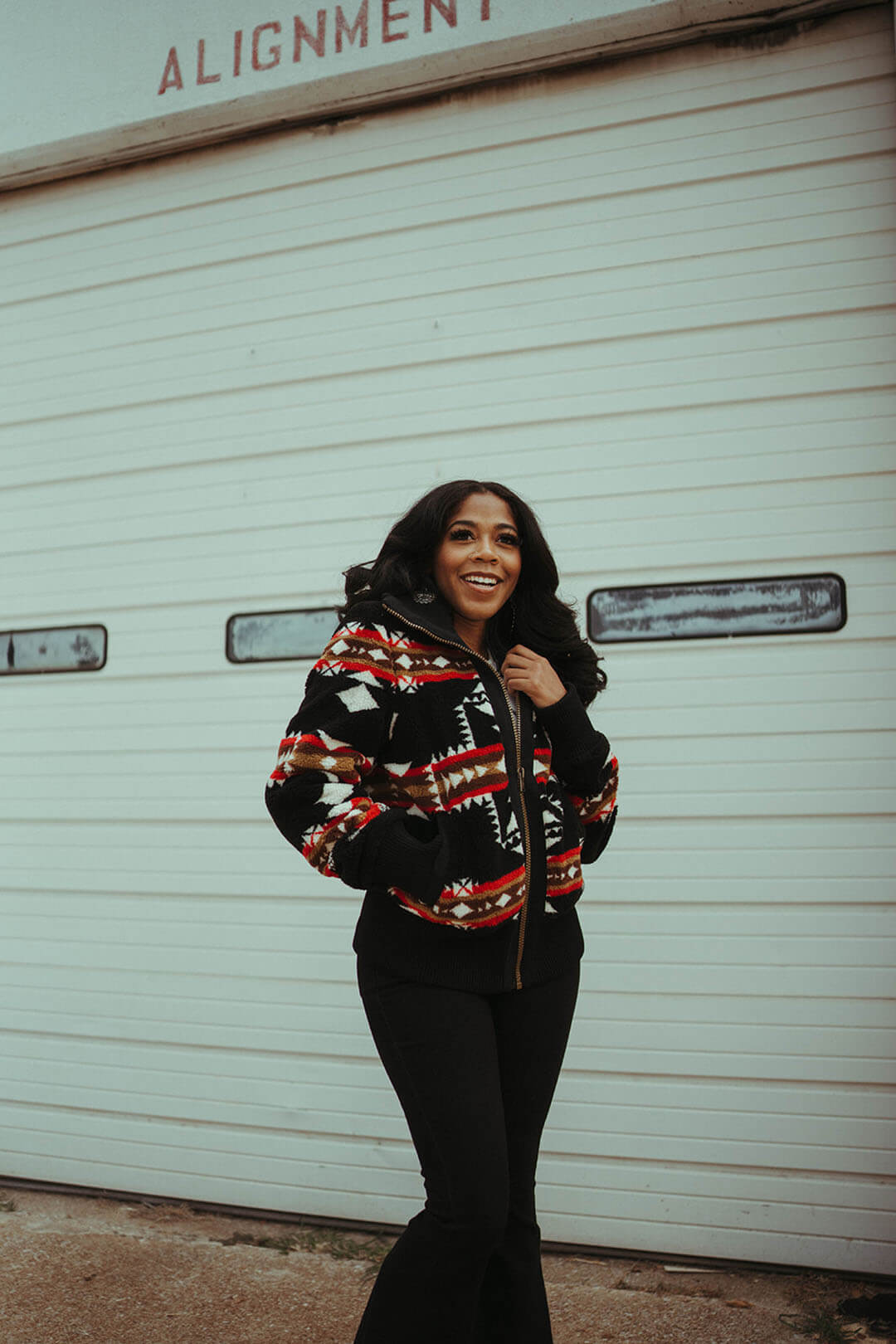 Woman modeling the foxglove range fleece bomber by Pendleton.  This bomber/jacket is zip up and features 2 front pockets to keep your hands warm. 