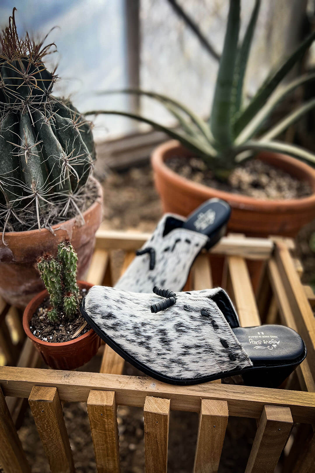 Side view of the Gina Mules by Agave Sky.  Black and white cowhide.