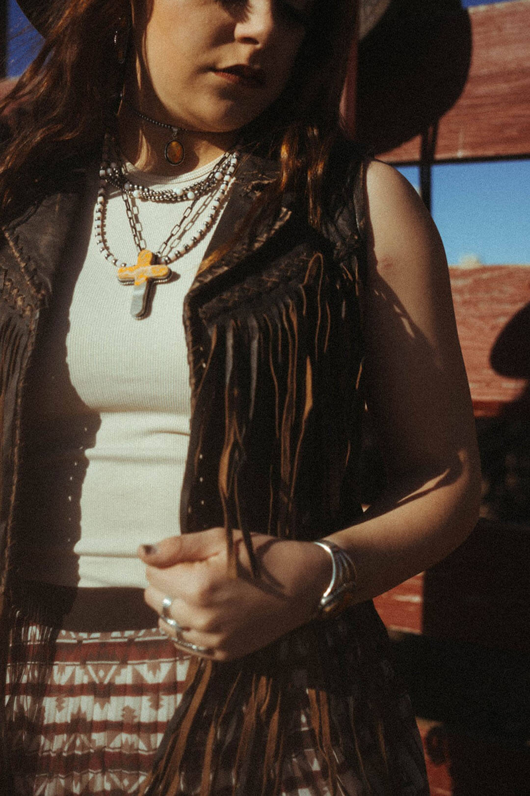 Close up image of the Cripple Creek Womens Fringe Leather Vest.  The vest has fringe on the bottom and on both sides.  