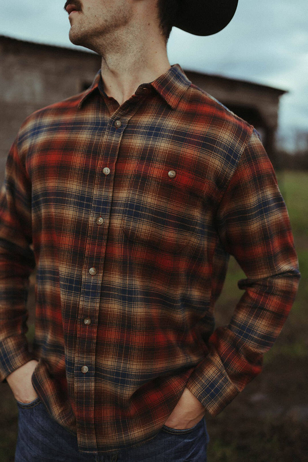 Close up picture of the copper/navy pendleton fremont flannel button up shirt.  The shirt features one chest pocket on the left side. 