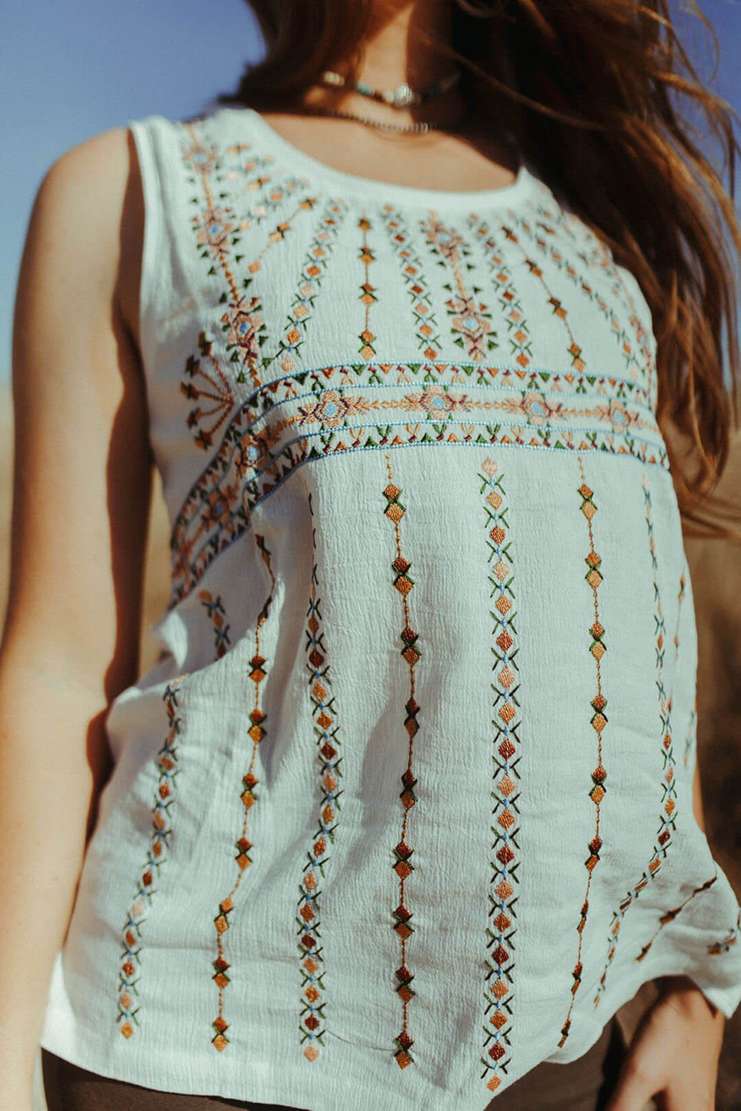 Close up image of the Ivory Embroidered Top.  Beautiful artwork througout.