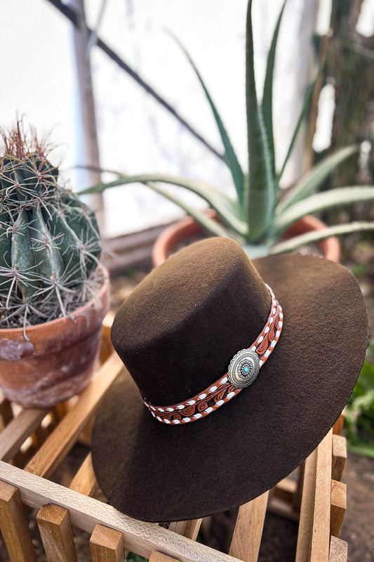 Picture of the Sedona Rose Cowgirl Hat in Chocolate by Charlie 1 Horse.  Has tooled leather band with silver concho and turcquise stone.  