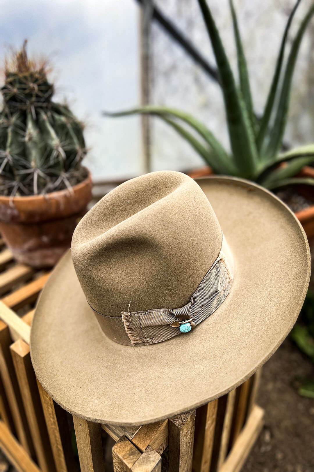 Picture of the Eureka Stetson Cowgirl Hat.  The hat is a fedora style hat.   Its features a ribbon hat band with a Turquoise stone on it. 