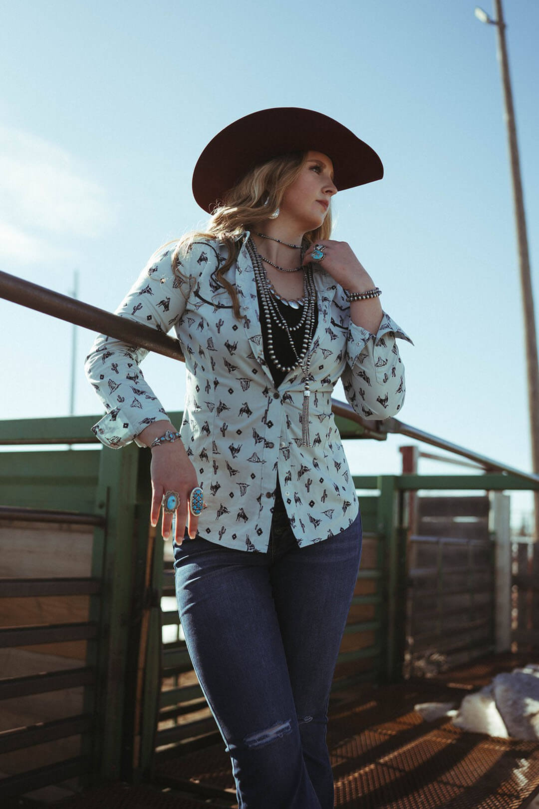 Woman modeling the Wild West Wrangler Pearl Snap Western Shirt.  