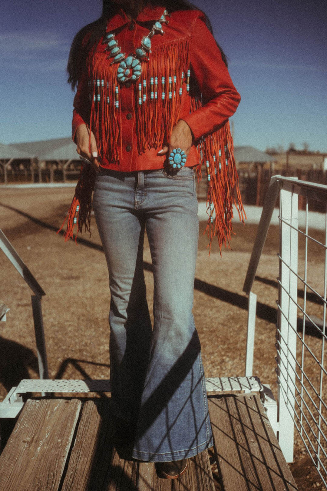 Woman modeling the Wrangler HIgh Rise Trumpet Flare in Helen.  A lighter color. 
