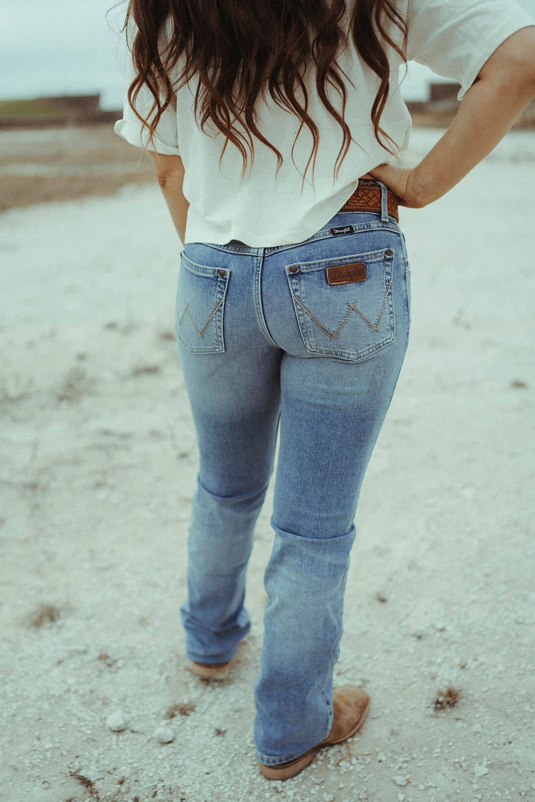 Back view of the wrangler retro mae bootcut jean in Lilibeth.  The jeans feature the wrangler emblem "W" on the pockets.