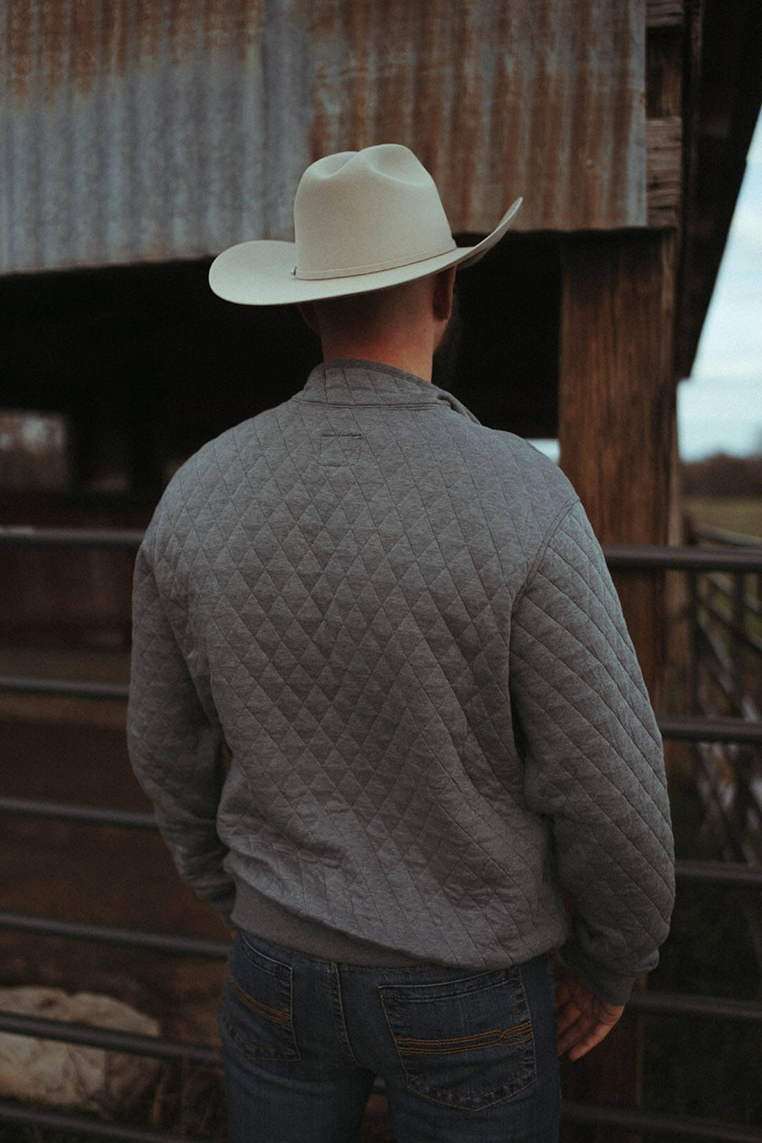 Man modeling the back side of the wrangler mens sweater.  T