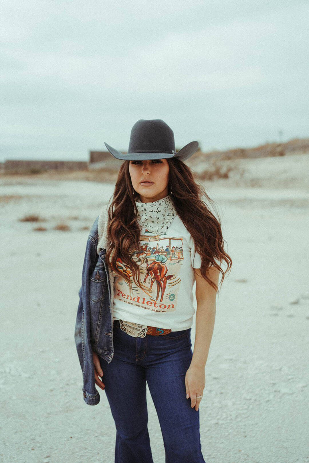 Woman modeling the XOXO Pendleton "where the west remains" tee by XOXO Company.