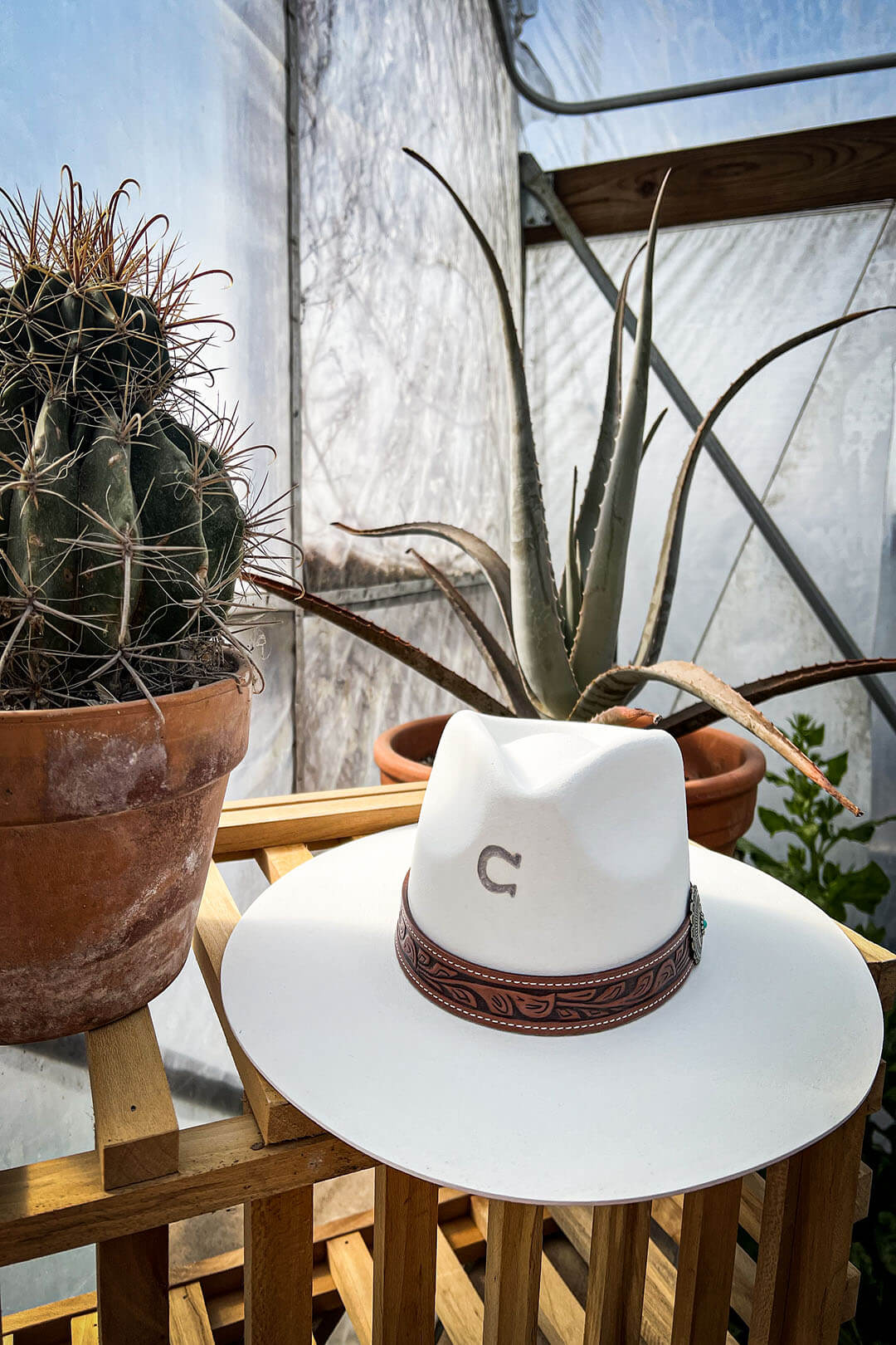 Image of the White Sands Cowgirl Hat by Charlie 1 Horse.  Hat has tooled band with silver concho. 