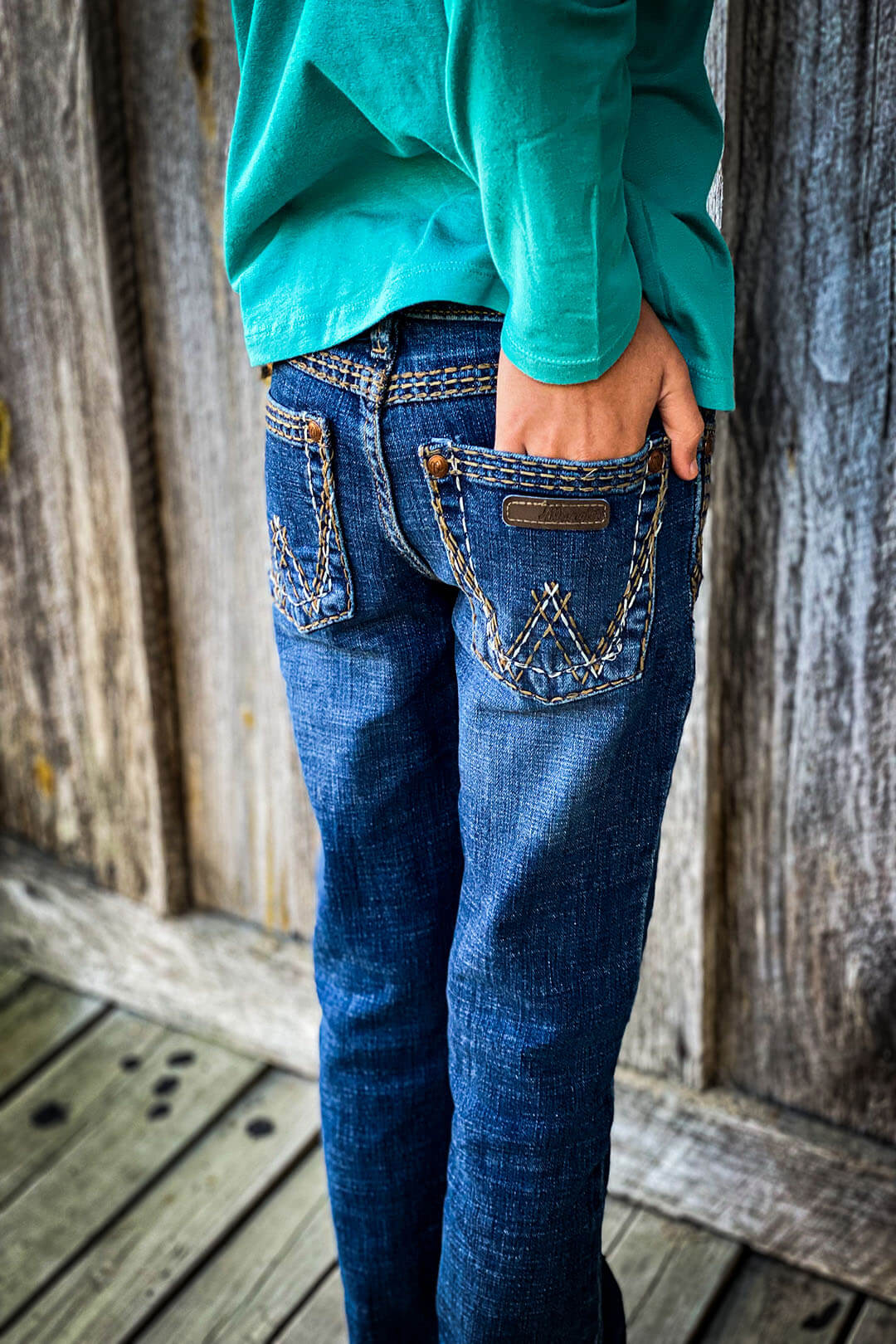 Back view of the wrangler girls retro jeans.  These are a darker wash jean,.